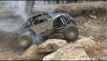 Adam Carter climbing steep ledge on Bump N Grind at GrayRock offroad park.